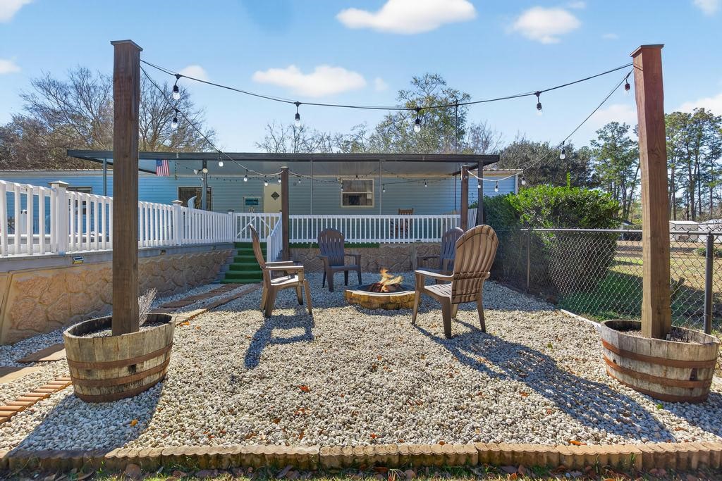 2744 Roy Sikes Road Hilliard, FL 32046 - Photo 73 of 97 a view of a porch with furniture and floor to ceiling window