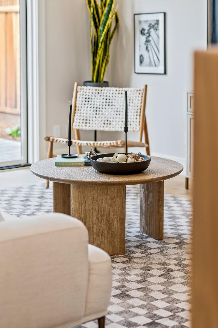 4875 Opal Street Capitola, CA 95010 - Photo 11 of 49 a kitchen with a table and a painting on the wall