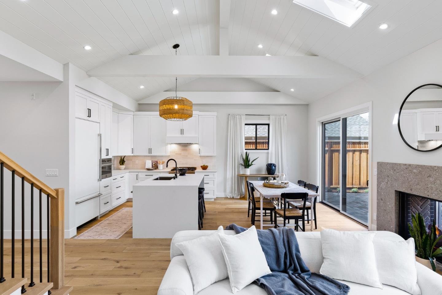 4875 Opal Street Capitola, CA 95010 - Photo 12 of 49 a living room with furniture a fireplace and a open kitchen view