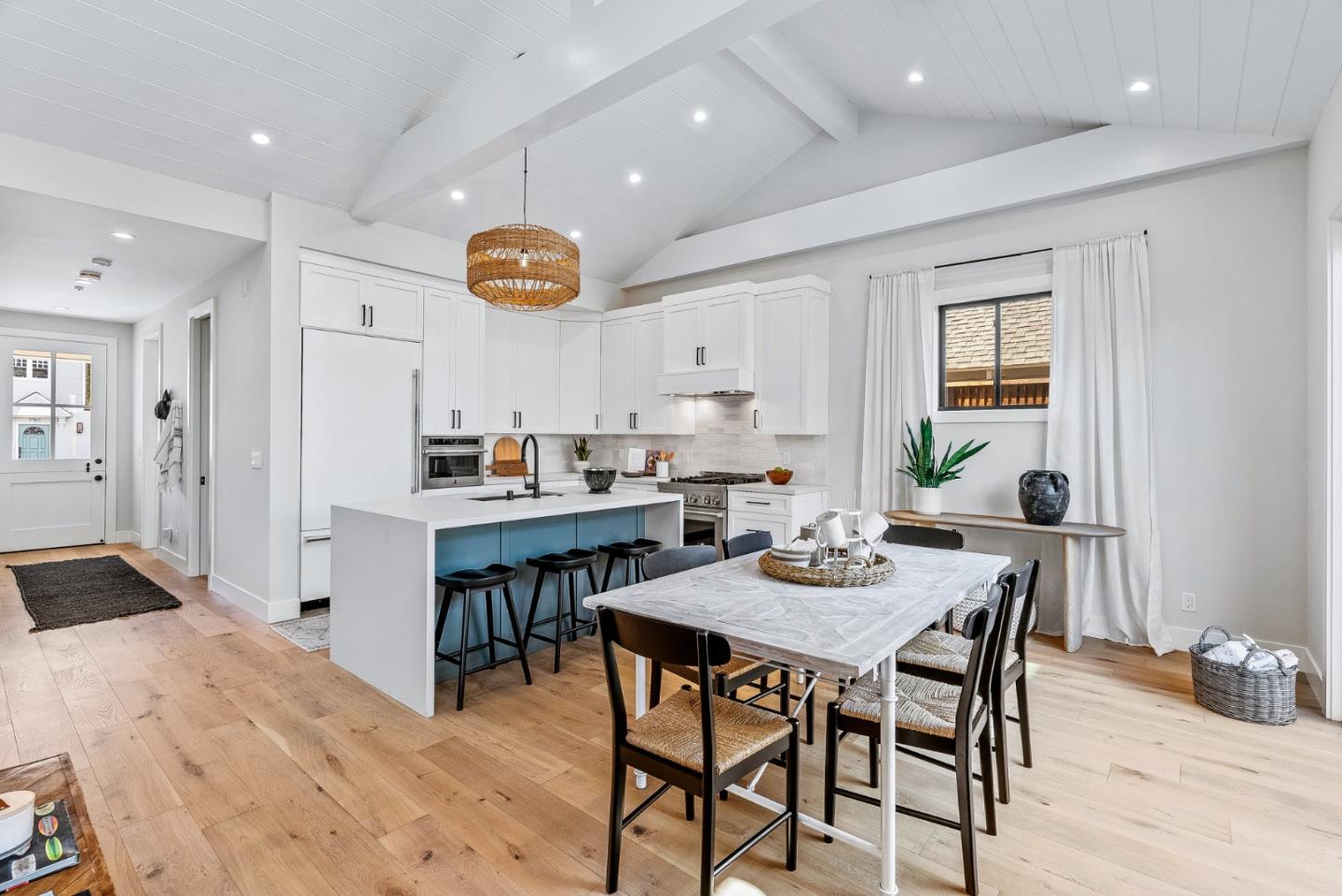 4875 Opal Street Capitola, CA 95010 - Photo 14 of 49 a kitchen with a table and chairs in it
