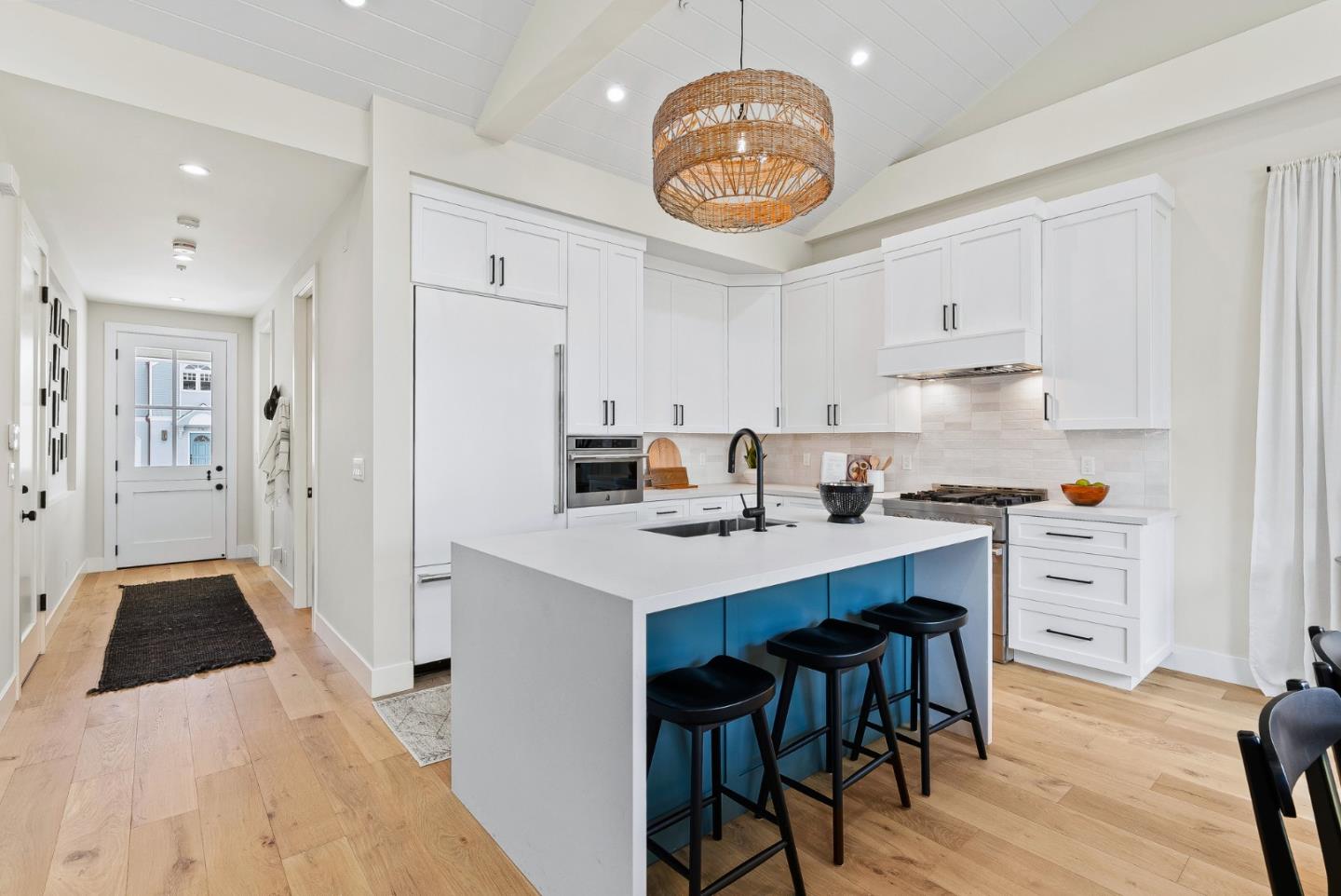4875 Opal Street Capitola, CA 95010 - Photo 15 of 49 a kitchen with a sink a refrigerator and cabinets