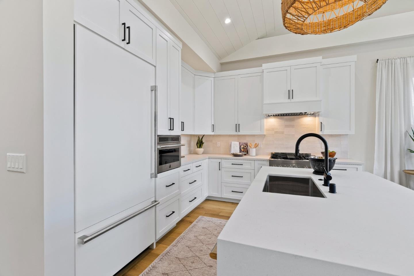 4875 Opal Street Capitola, CA 95010 - Photo 16 of 49 a kitchen with stainless steel appliances granite countertop a white stove top oven and sink