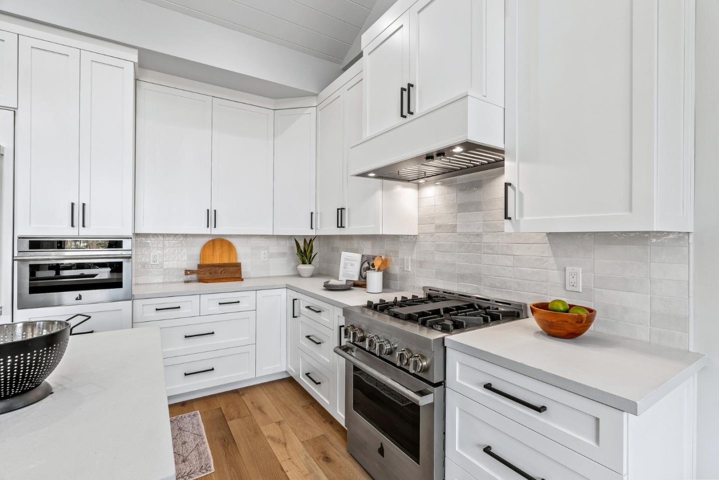 4875 Opal Street Capitola, CA 95010 - Photo 20 of 49 a kitchen with stainless steel appliances a stove a sink and cabinets