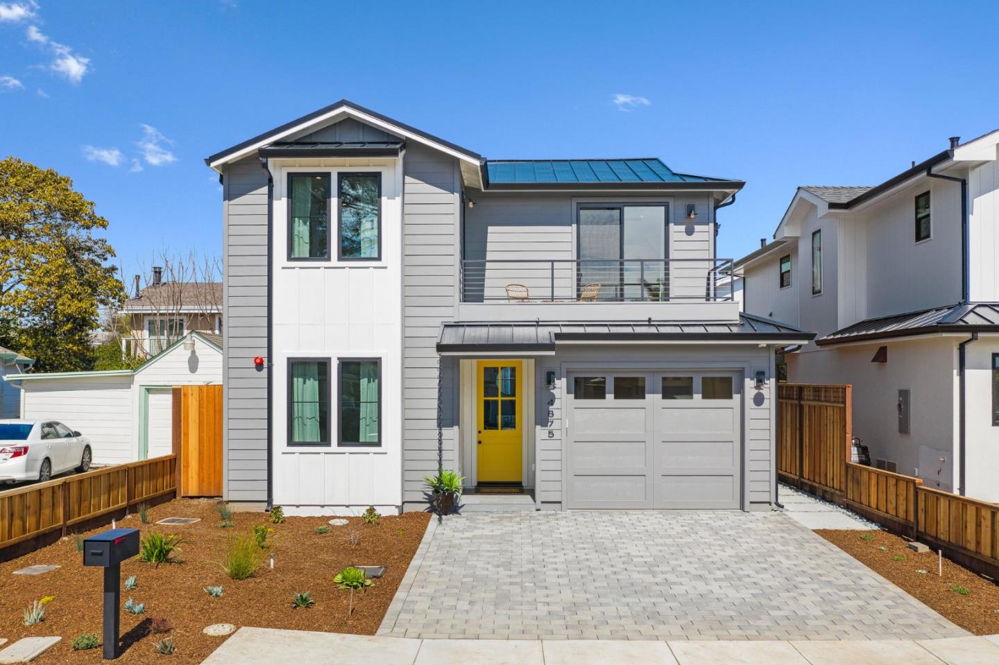 4875 Opal Street Capitola, CA 95010 - Photo 2 of 49 a front view of a house with a garage