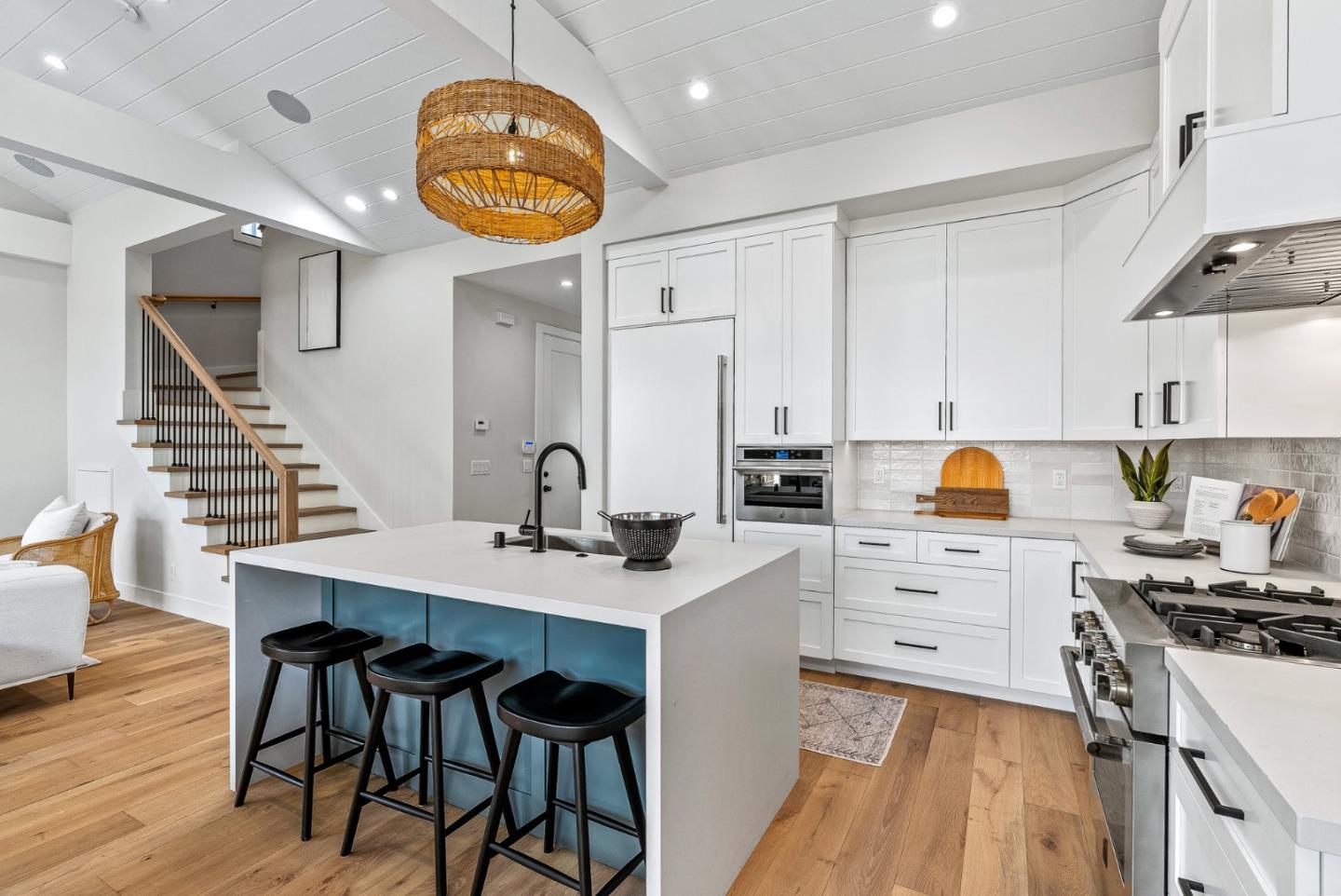 4875 Opal Street Capitola, CA 95010 - Photo 21 of 49 a kitchen with stainless steel appliances a table chairs and a stove