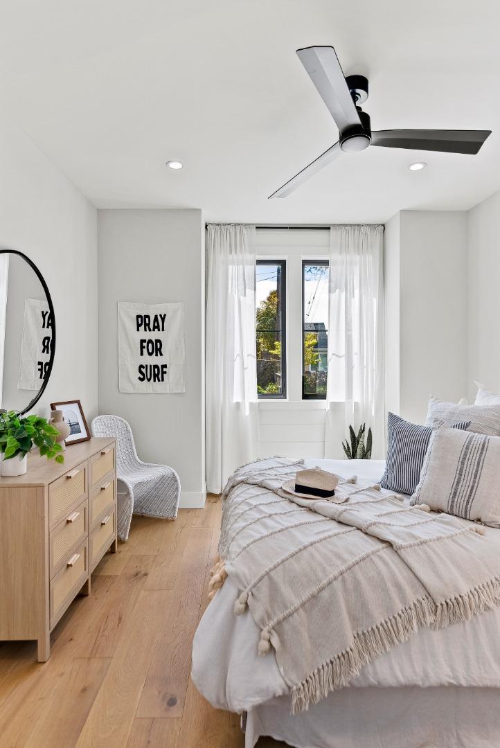 4875 Opal Street Capitola, CA 95010 - Photo 24 of 49 a bedroom with a bed window and potted plant on the dresser