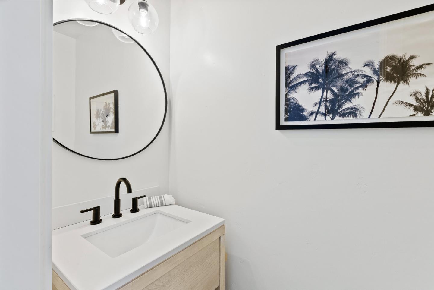 4875 Opal Street Capitola, CA 95010 - Photo 27 of 49 a bathroom with a sink and a mirror