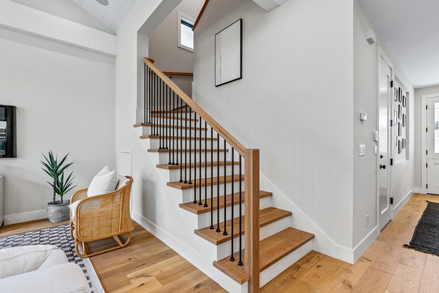 4875 Opal Street Capitola, CA 95010 - Photo 28 of 49 a view of a staircase with wooden floor and a potted plant
