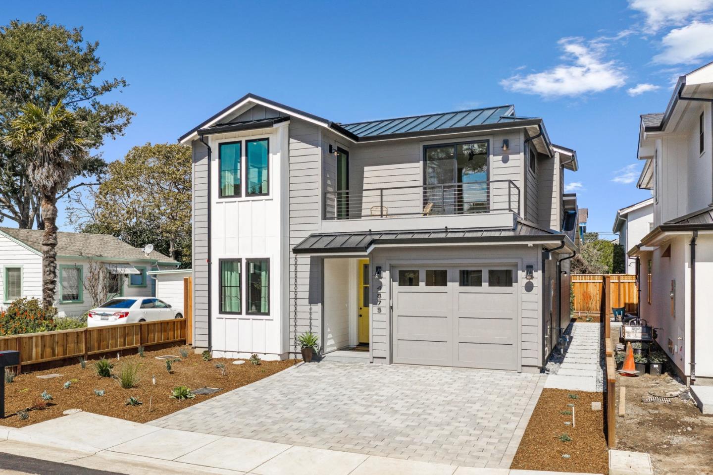 4875 Opal Street Capitola, CA 95010 - Photo 3 of 49 a front view of a house with a garden