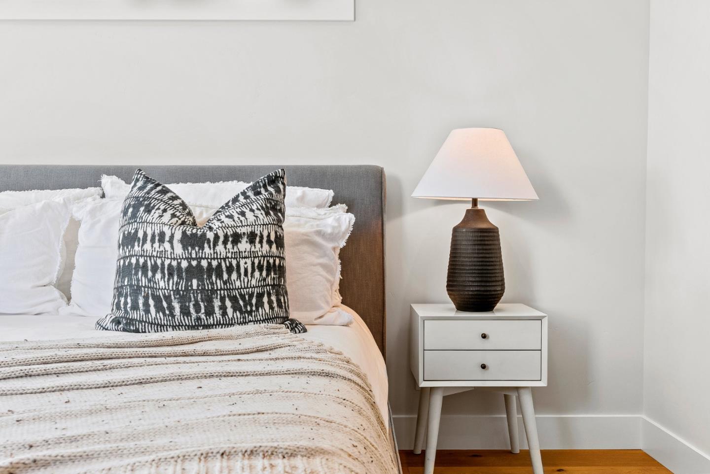 4875 Opal Street Capitola, CA 95010 - Photo 31 of 49 a bed sitting in a bedroom next to a window with pc on the dresser