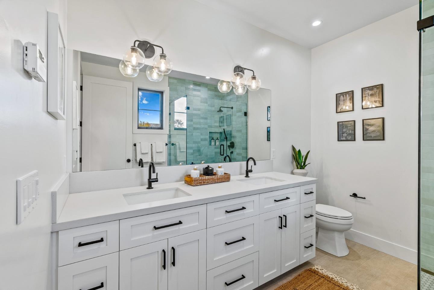 4875 Opal Street Capitola, CA 95010 - Photo 36 of 49 a bathroom with a double vanity sink mirror and toilet