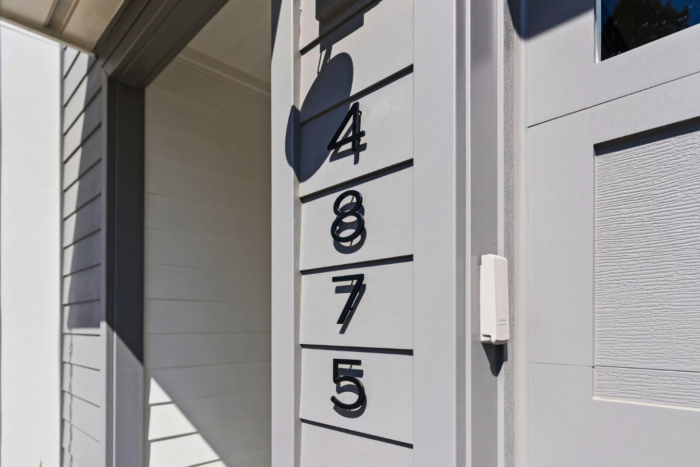 4875 Opal Street Capitola, CA 95010 - Photo 4 of 49 a view of a hallway with wooden floor and staircase