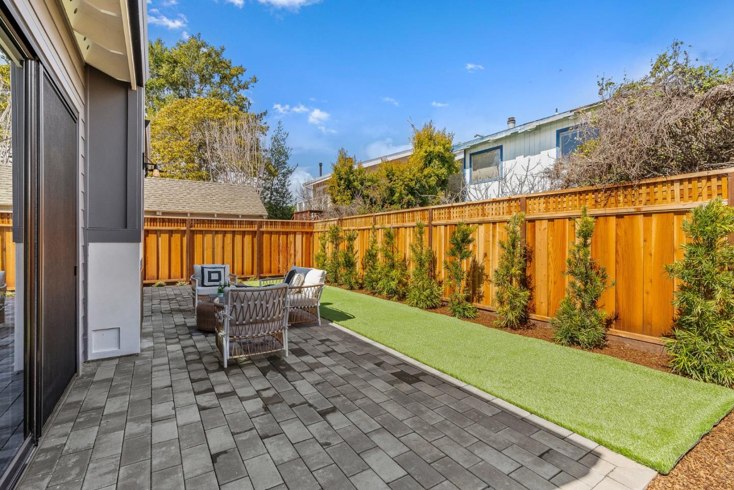 4875 Opal Street Capitola, CA 95010 - Photo 41 of 49 a patio with table and chairs