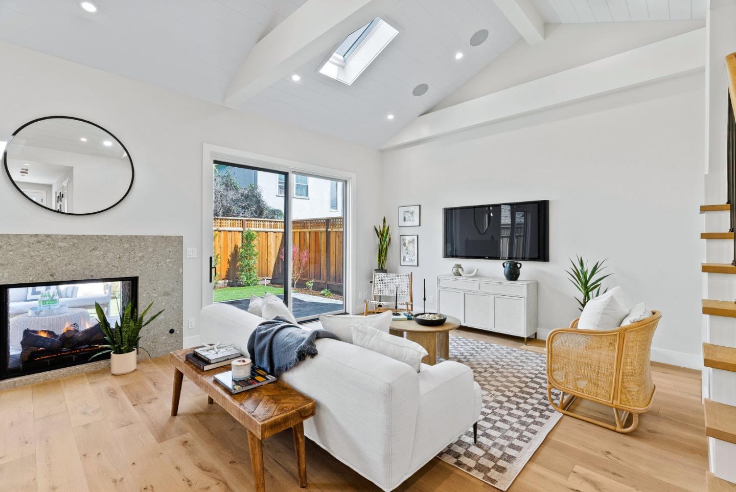 4875 Opal Street Capitola, CA 95010 - Photo 7 of 49 a living room with furniture a fireplace and a flat screen tv