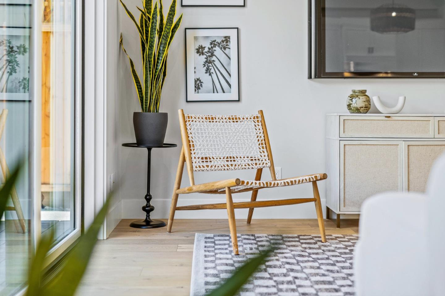 4875 Opal Street Capitola, CA 95010 - Photo 9 of 49 a living room with a couch and a potted plant on a stool
