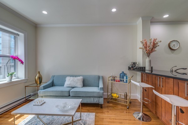 15 Garrison Street, Unit 9 Boston, MA 02116 - Photo 2 of 18 a living room with furniture and a window