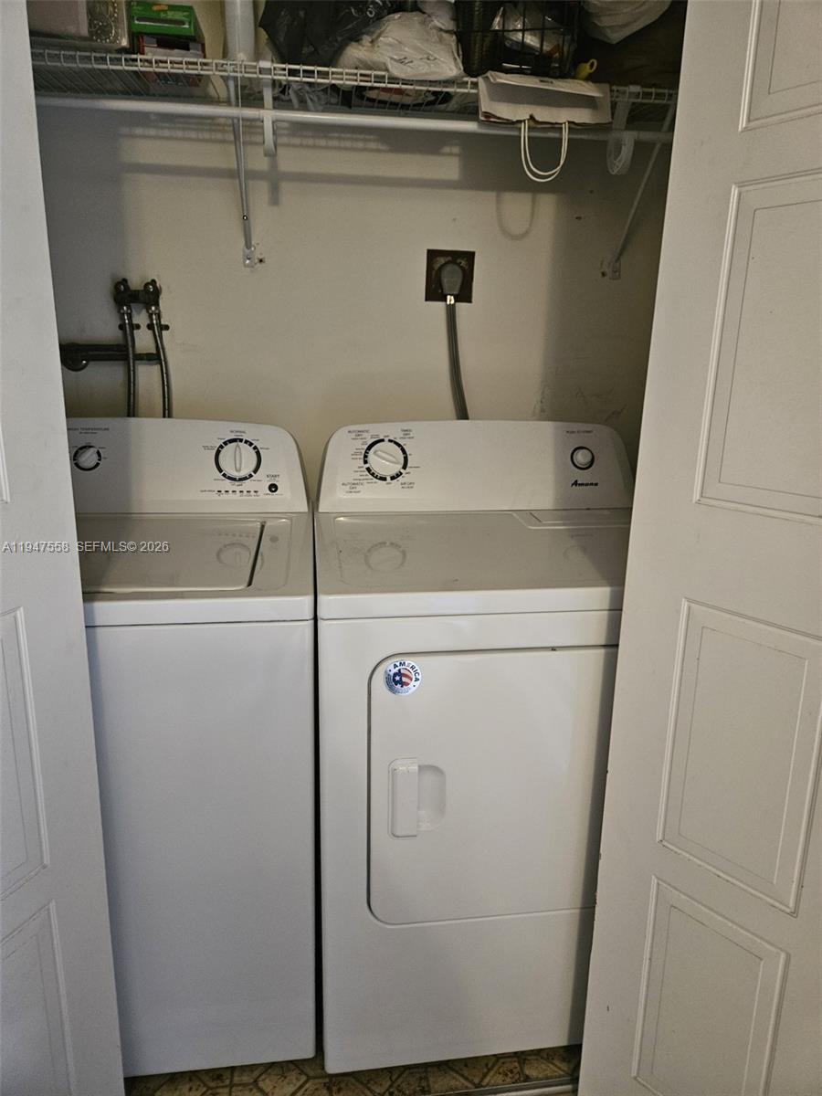 3591 Inverrary Drive, Unit 405 Lauderhill, FL 33319 - Photo 6 of 9 a utility room with dryer and washer