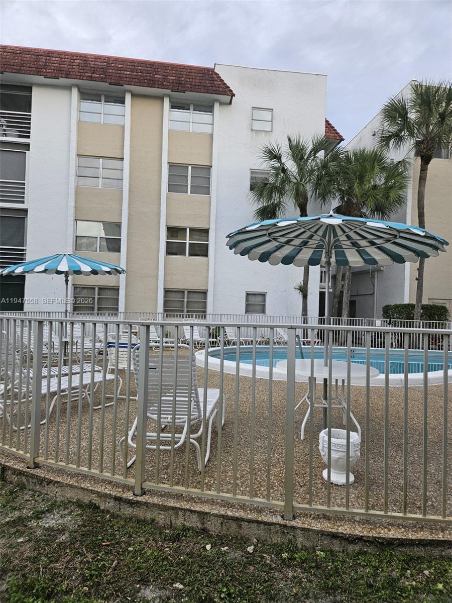 3591 Inverrary Drive, Unit 405 Lauderhill, FL 33319 - Photo 8 of 9 a front view of a house with a porch