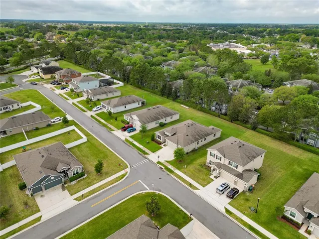 a view of swimming pool with outdoor seating and yard in the back