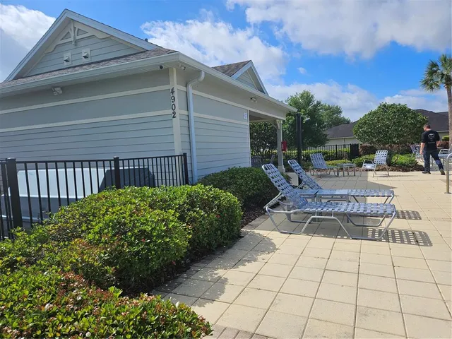 a view of swimming pool with lounge chair