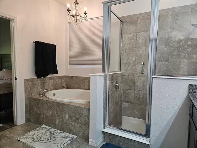 a bathroom with a sink vanity and mirror