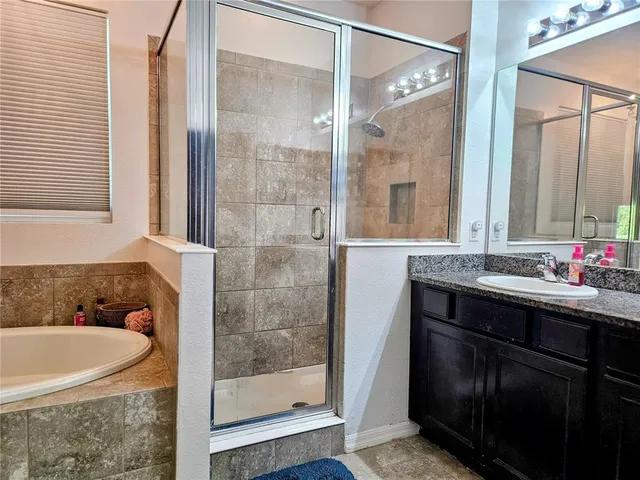 a large kitchen with a table and chairs