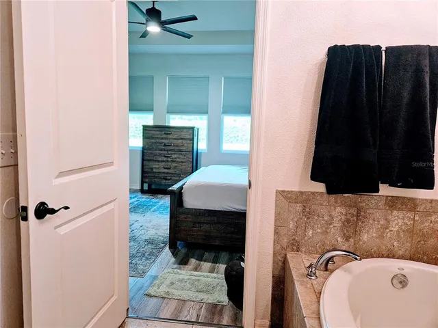 a view of a room with gym equipment and a window