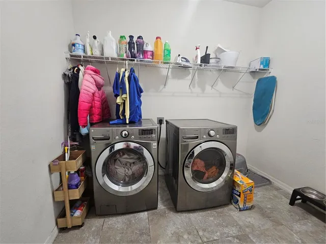 a bathroom with double sink and a mirror