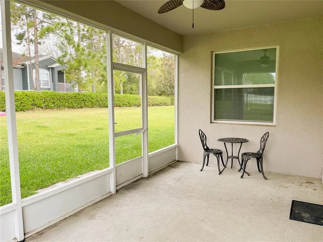a view of a room that has a bed and a chair