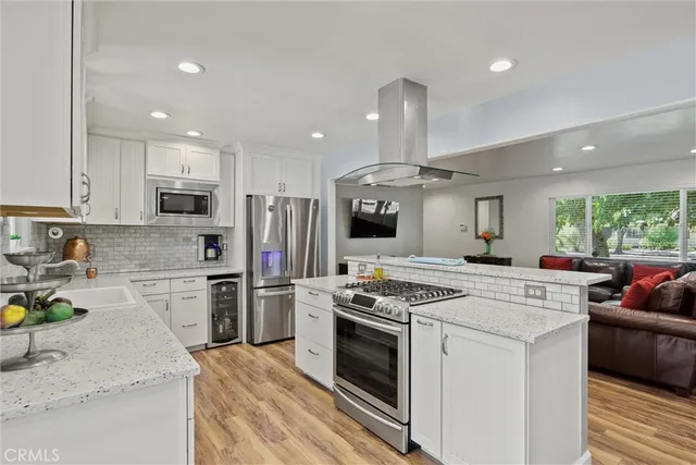 a kitchen with a stove sink and refrigerator