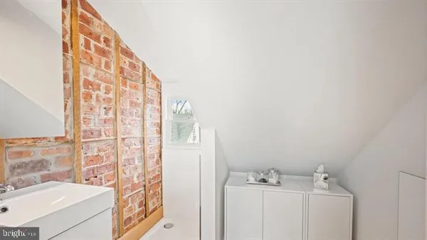 a bathroom with a sink a vanity and a mirror