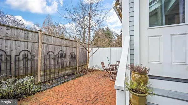 a backyard of a house with potted plants