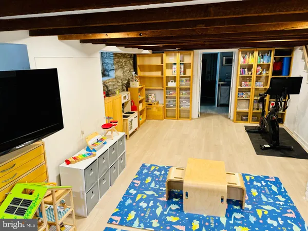 a bedroom with furniture and a flat screen tv