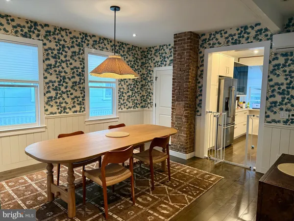 a room with dining table and chairs