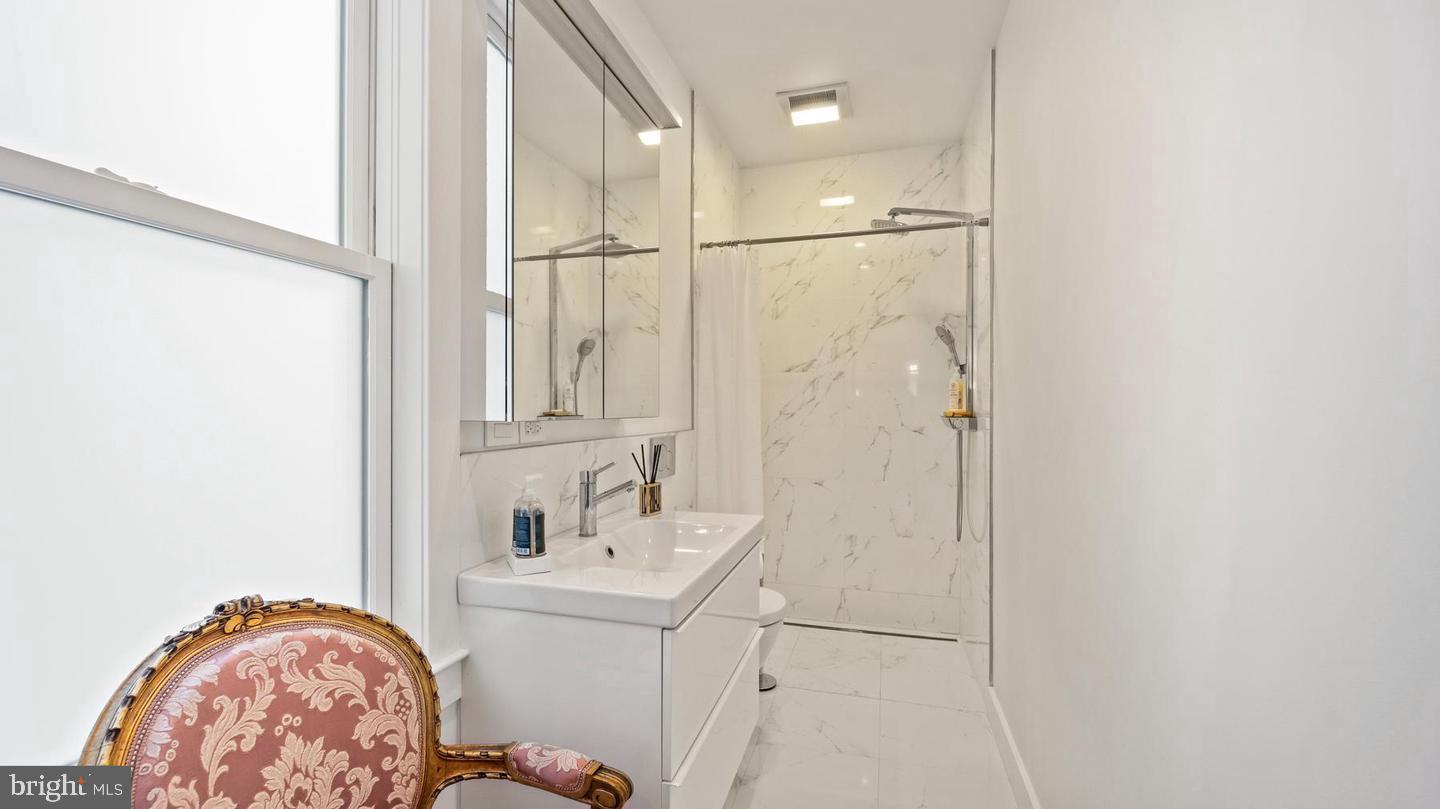 28 Bank Street Princeton, NJ 08542 - Photo 7 of 18 a bathroom with a sink and a mirror