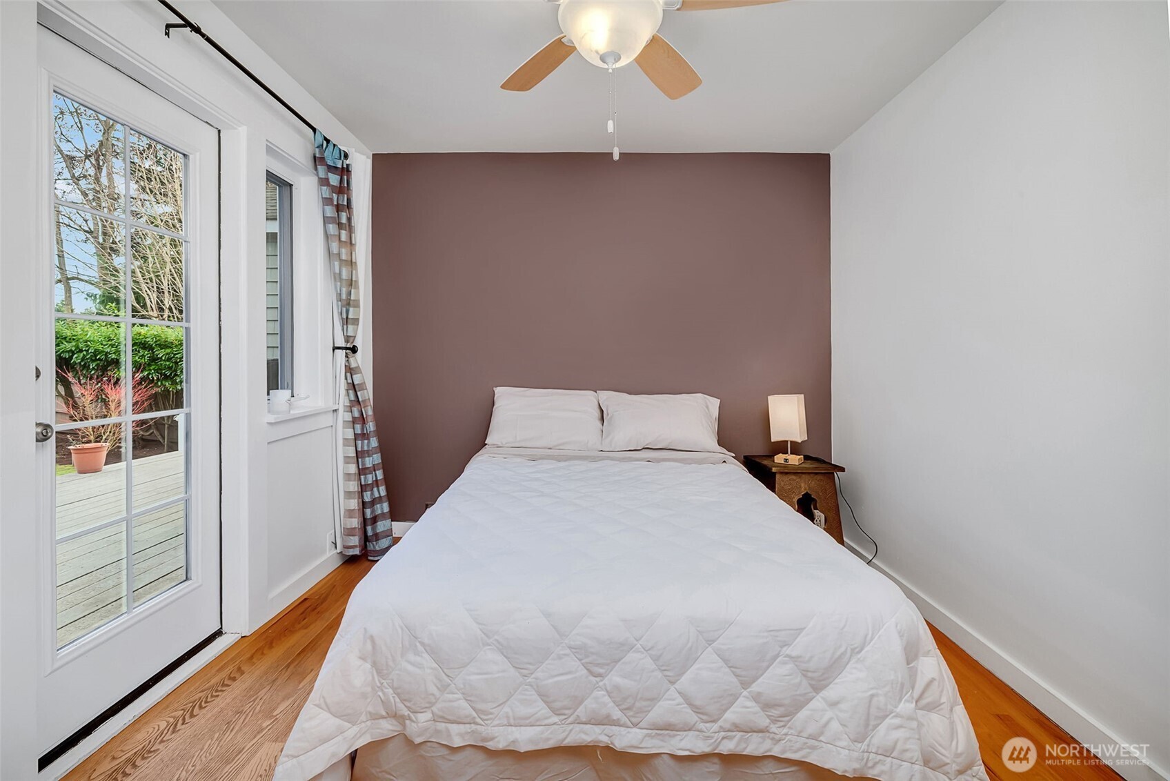 2726 50th Avenue Southwest Seattle, WA 98116 - Photo 20 of 40 a bedroom with a bed and a large window