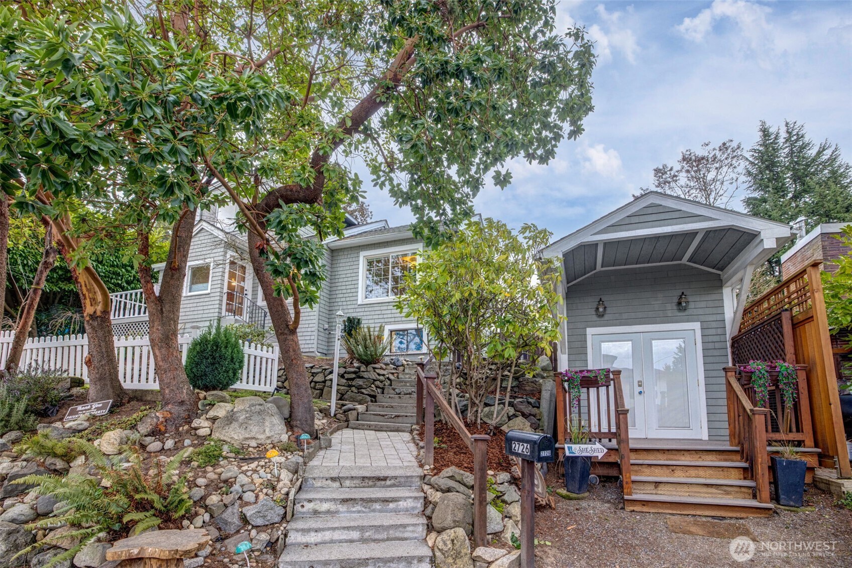 2726 50th Avenue Southwest Seattle, WA 98116 - Photo 2 of 40 a front view of a house with garden