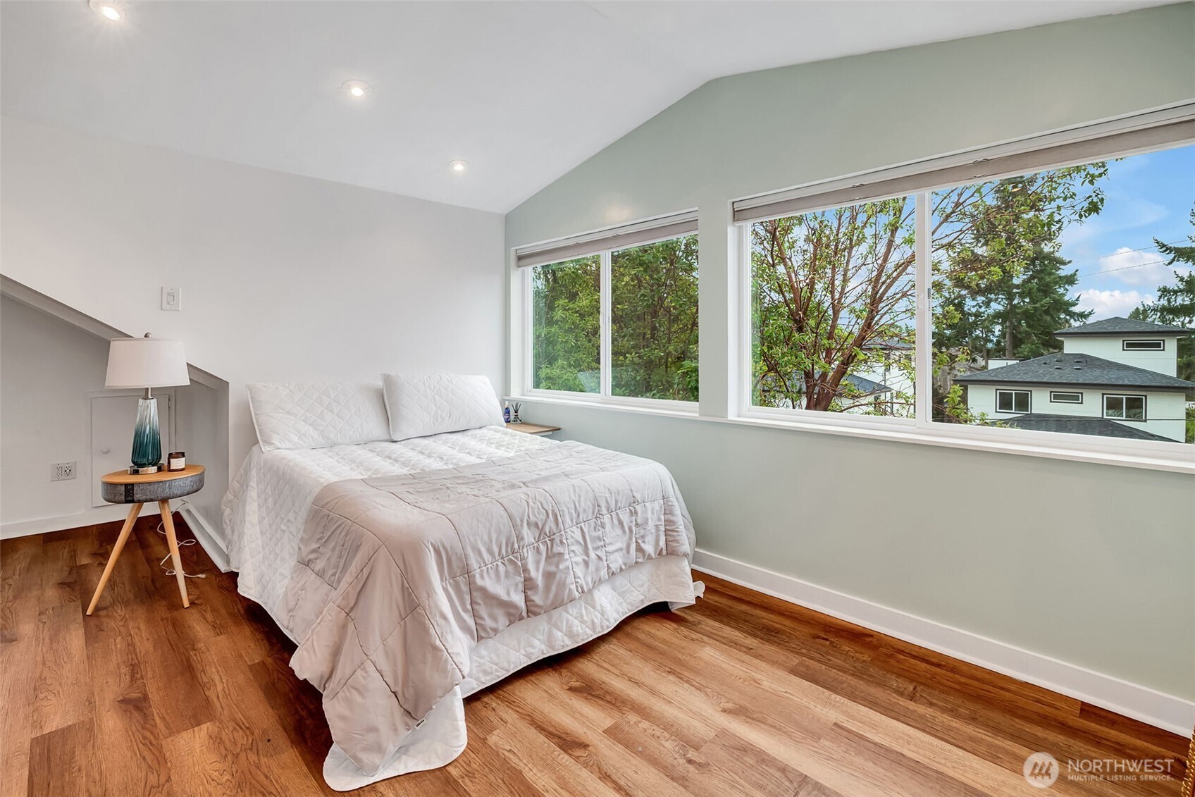 2726 50th Avenue Southwest Seattle, WA 98116 - Photo 24 of 40 a bedroom with a bed and a window