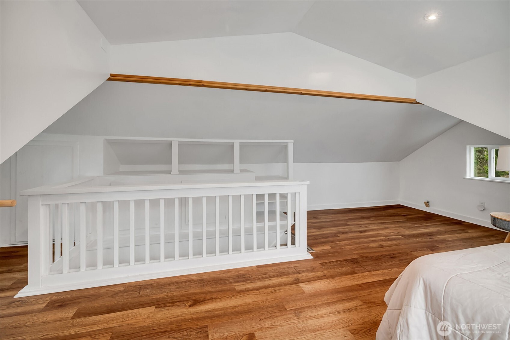 2726 50th Avenue Southwest Seattle, WA 98116 - Photo 25 of 40 a view of a bedroom with wooden floor