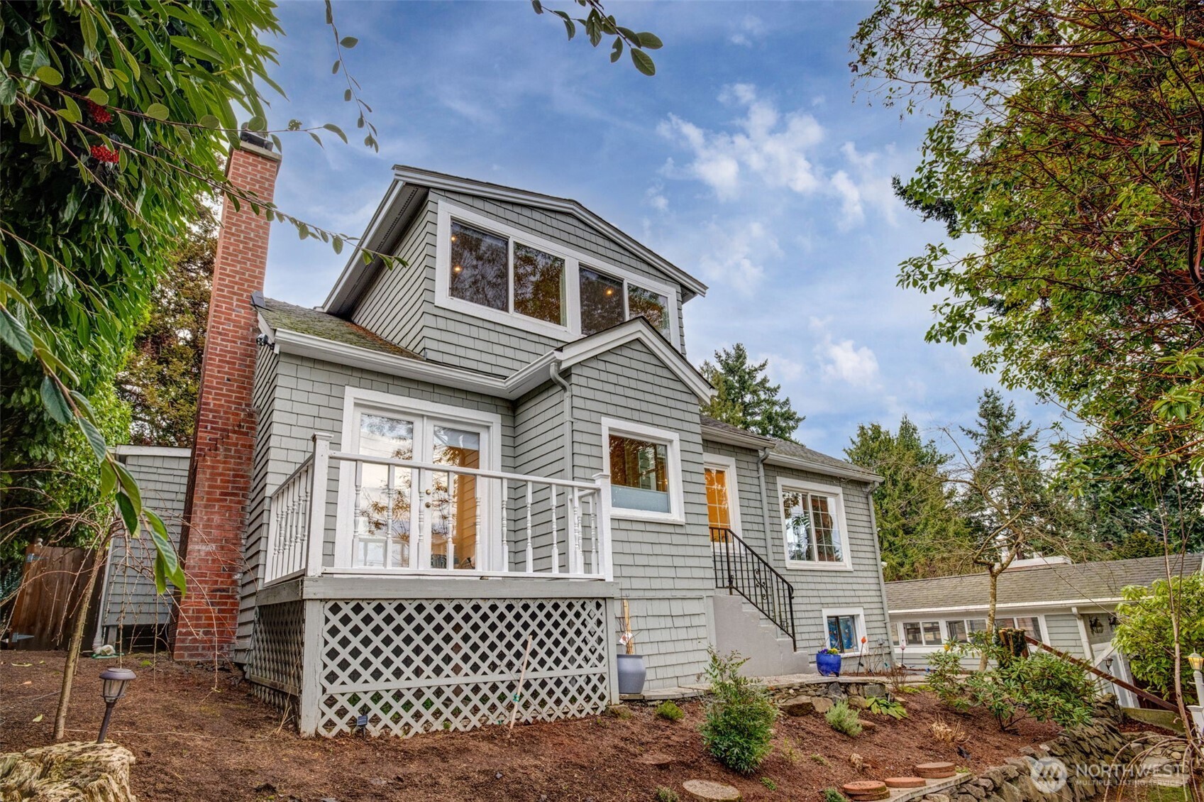 2726 50th Avenue Southwest Seattle, WA 98116 - Photo 3 of 40 a front view of a house with a yard