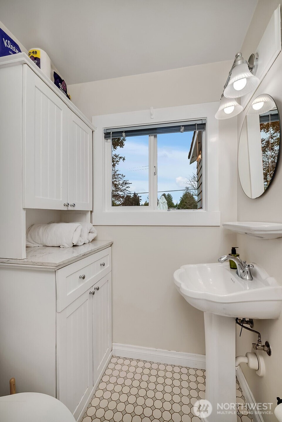 2726 50th Avenue Southwest Seattle, WA 98116 - Photo 31 of 40 a bathroom with a sink a mirror and a toilet