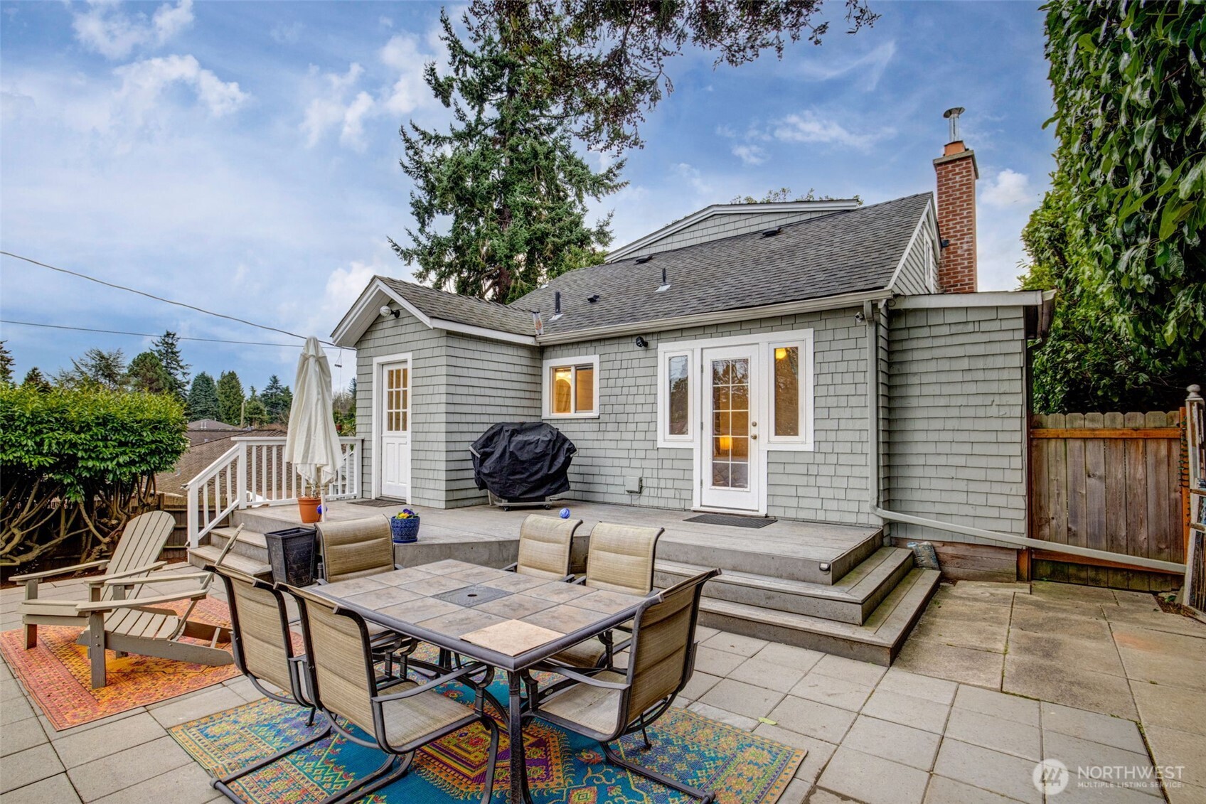 2726 50th Avenue Southwest Seattle, WA 98116 - Photo 36 of 40 a backyard of a house with table and chairs
