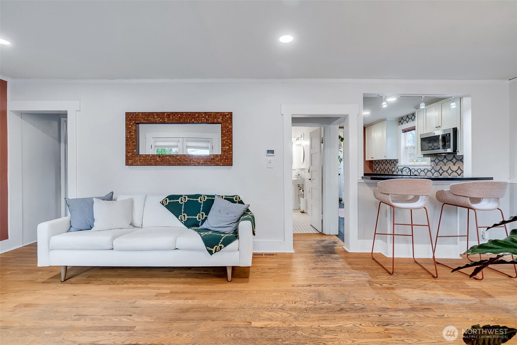 2726 50th Avenue Southwest Seattle, WA 98116 - Photo 6 of 40 a living room with furniture and kitchen view