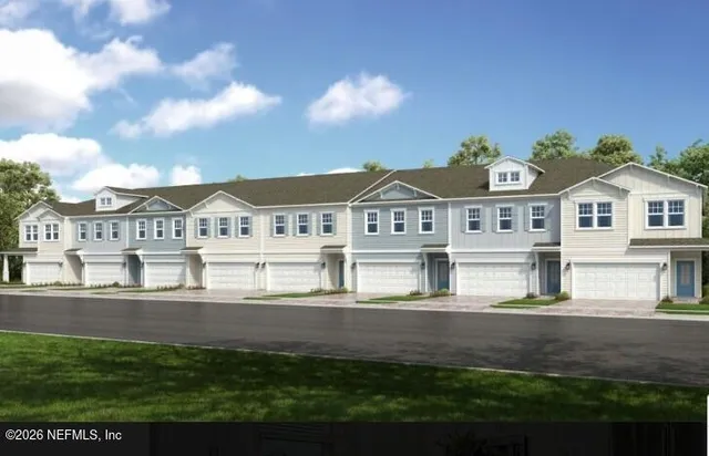 a view of houses with yard and outdoor seating