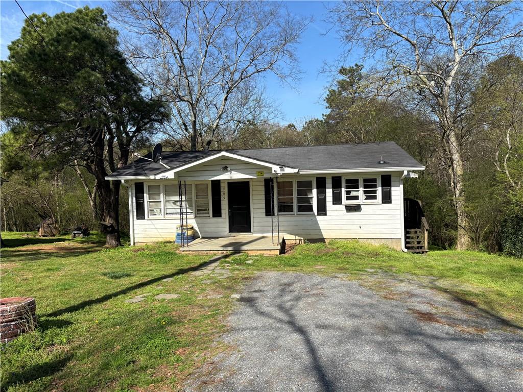 309 Crest Drive Calhoun, GA 30701 - Photo 2 of 23 a front view of a house with a yard