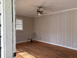 309 Crest Drive Calhoun, GA 30701 - Photo 7 of 23 a view of a livingroom with wooden floor and a ceiling fan