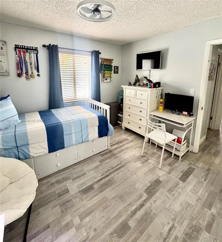 a bedroom with a bed and a couch