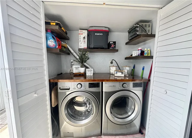 a utility room with dryer and washer
