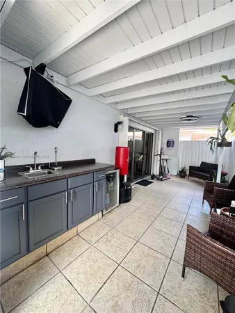 a kitchen with stainless steel appliances kitchen island granite countertop a sink and cabinets