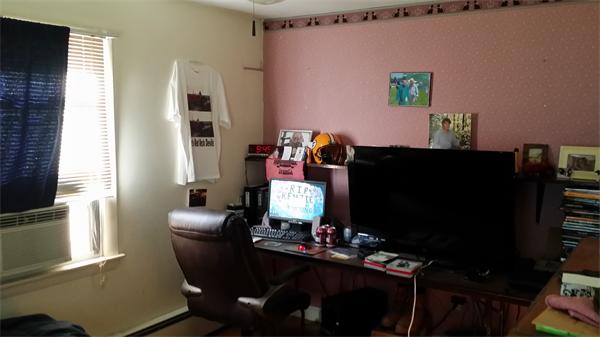 62 Bigelow Road Lancaster, MA 01523 - Photo 10 of 17 a living room with furniture a flat screen tv and a window